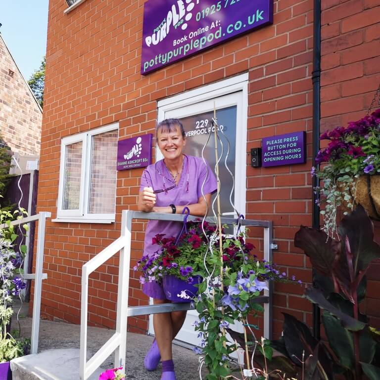 Potty Purple Pod Dianne Ashcroft outside her Warrington podiatry clinic